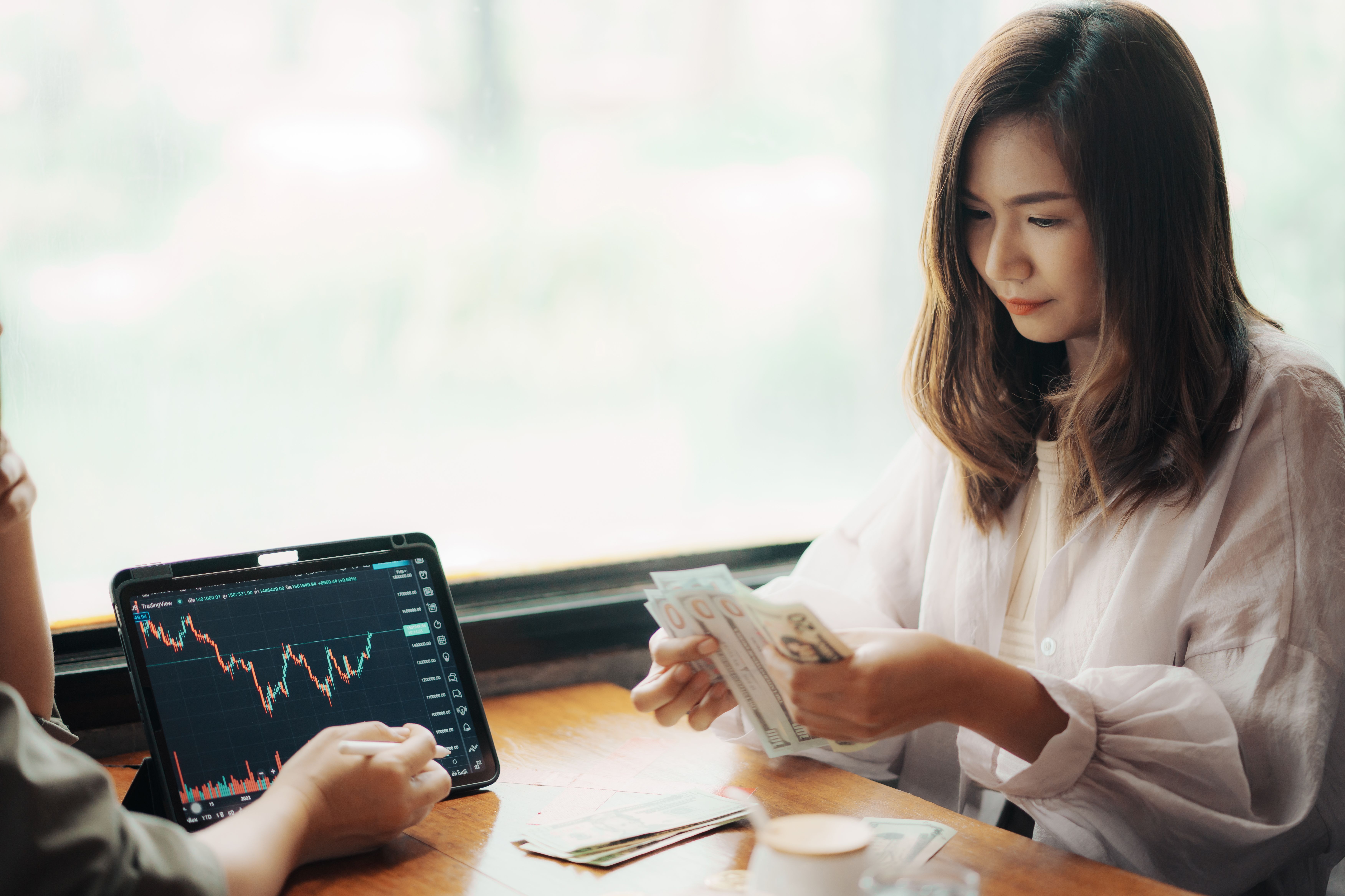 female-traders-discuss-direction-cryptocurrency-take-profit.jpg